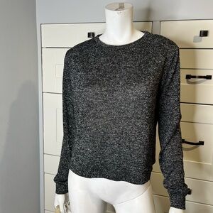 George. Size medium. Black and gray sparkly. Pull over sweater.